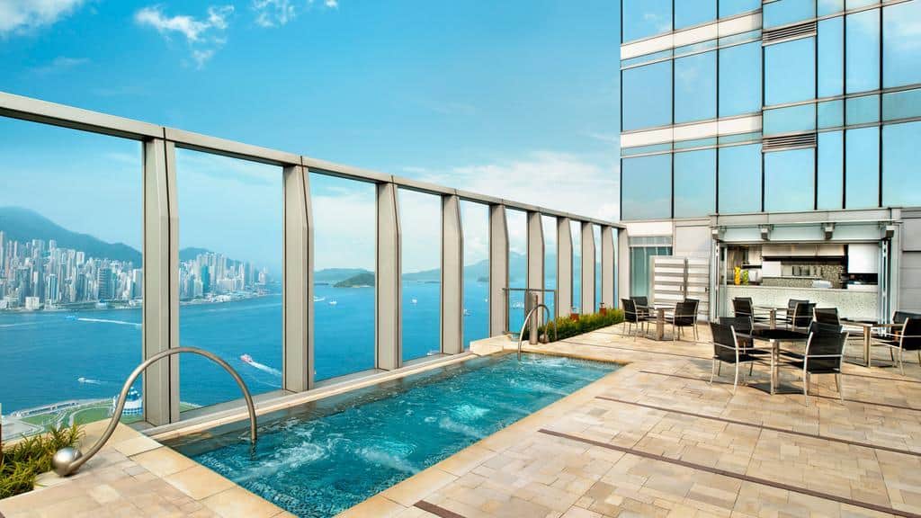 An open Swimming pool on the terrace of hotel W Hong Kong